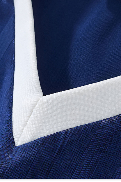 Color-blocked collegiate style V-neck short-sleeved top