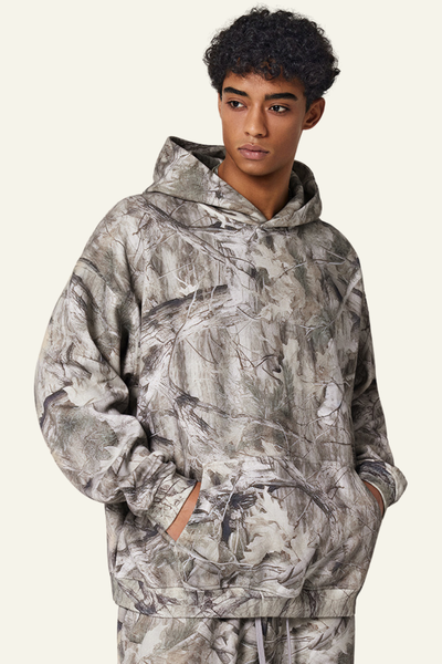 Camouflage sweatshirt with fleece lining and hood.